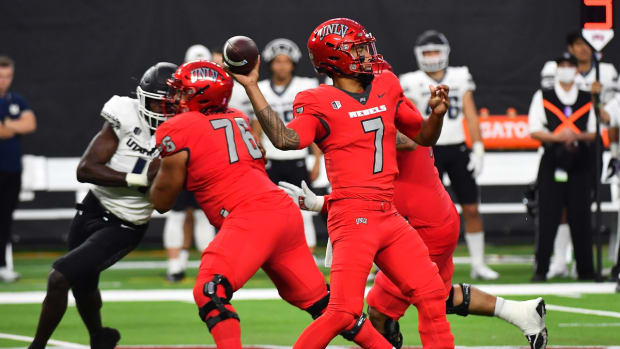 Oct 16, 2021; Paradise, Nevada, USA; UNLV Rebels quarterback Cameron Friel (7) looks to make a throw against the Utah State Aggies at Allegiant Stadium. Mandatory Credit: Stephen R. Sylvanie-USA TODAY Sports